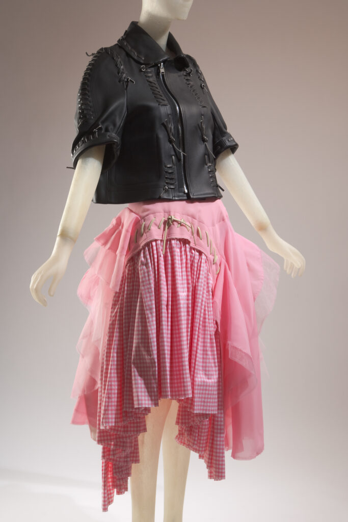 a mannequin wearing a a block crop top with a pink skirt